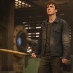 Walker Scobell as Percy Jackson holding Riptide in Percy Jackson and the Olympians Season 3