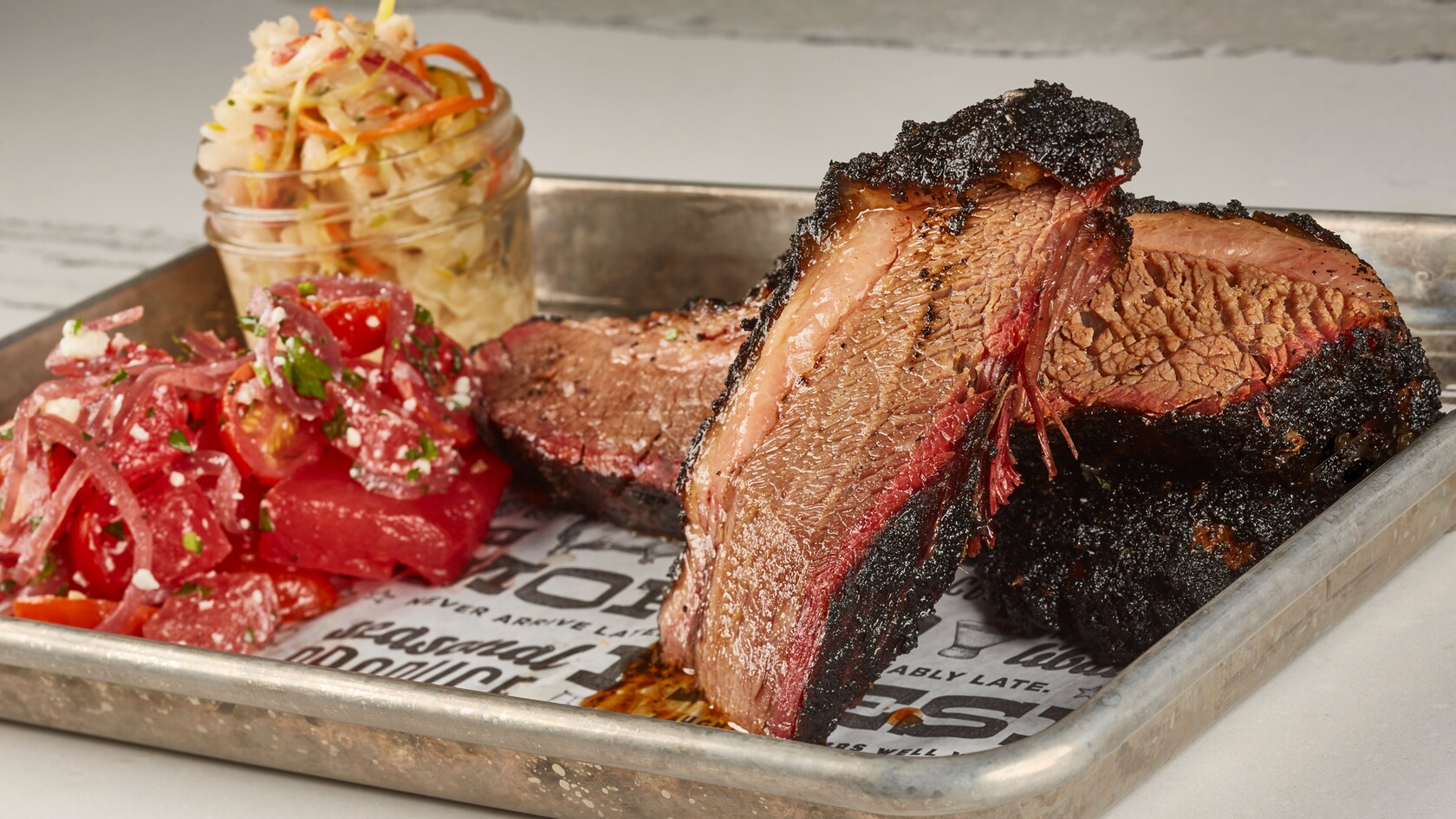 Smoked brisket plate with tomatoes and coleslaw at The Polite Pig at Disney Springs