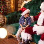 Santa Claus greeting a family at Disney Springs