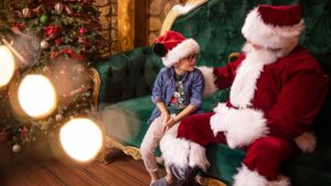 Santa Claus greeting a family at Disney Springs