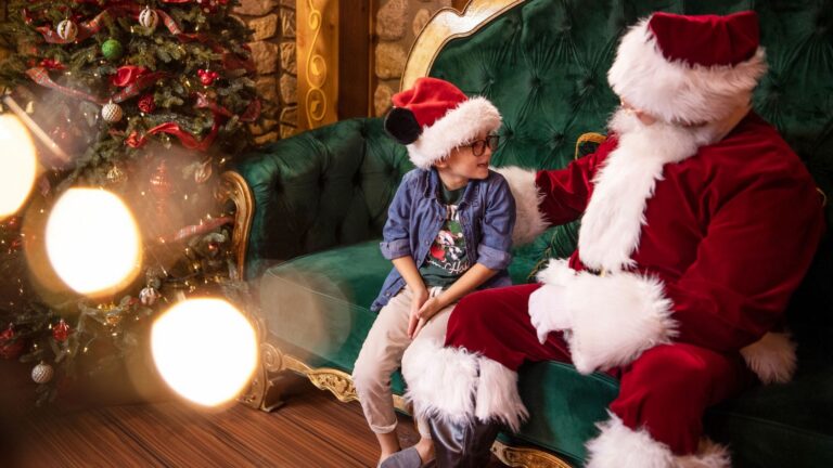 Santa Claus greeting a family at Disney Springs