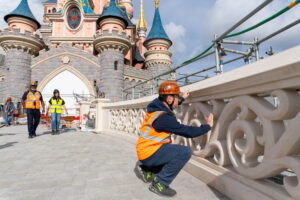The refurbished Sleeping Beauty Castle bridge at Disneyland Paris with its new granite paving and rebuilt limestone balusters