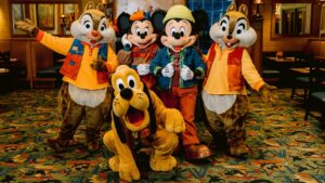 Mickey Mouse, Minnie Mouse, Pluto, Chip and Dale in fall outfits inside Storytellers Cafe at Disney's Grand Californian Hotel
