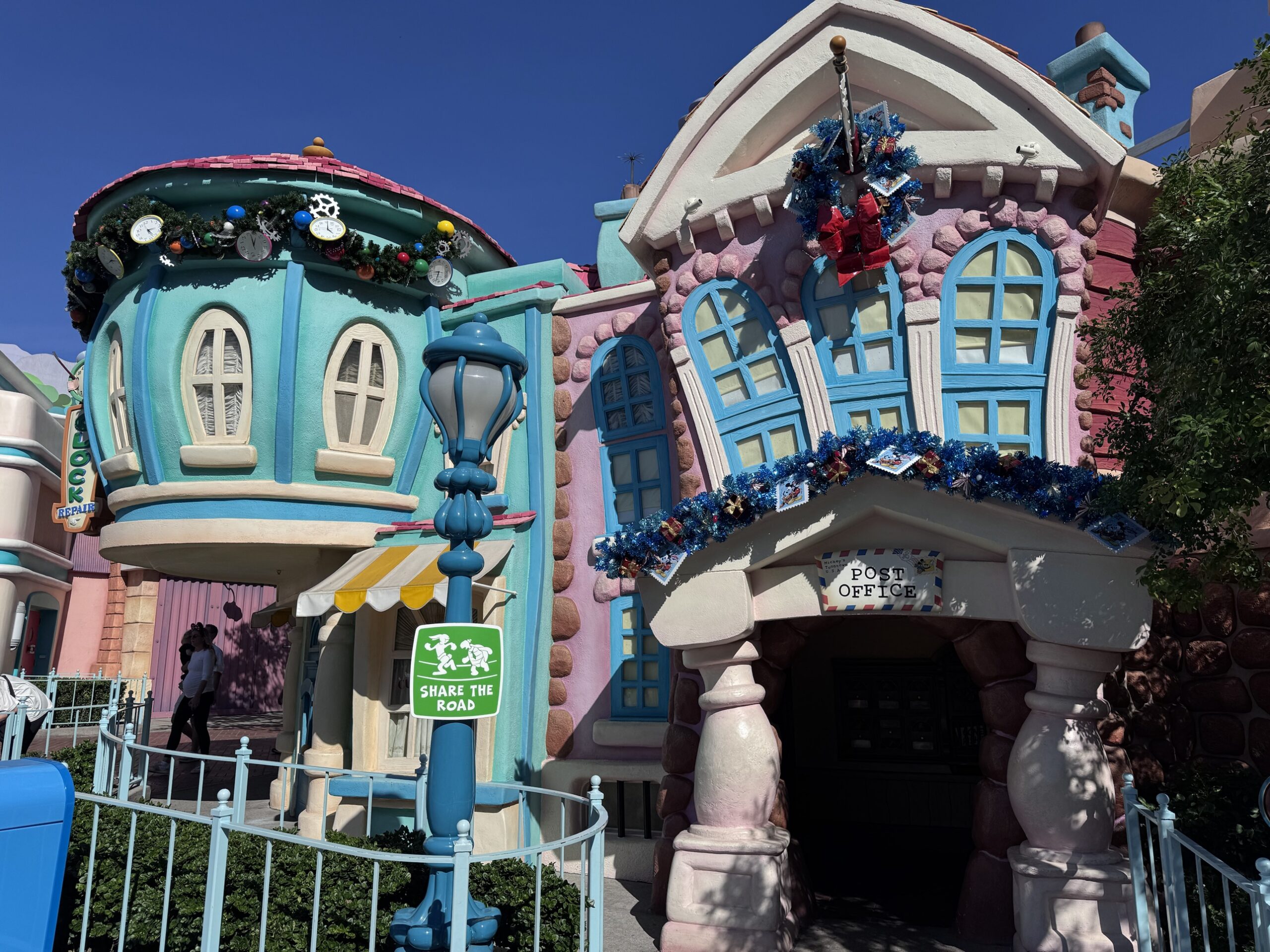 Christmas garland on the clock repair shop and post office in Mickey's Toontown at Disneyland