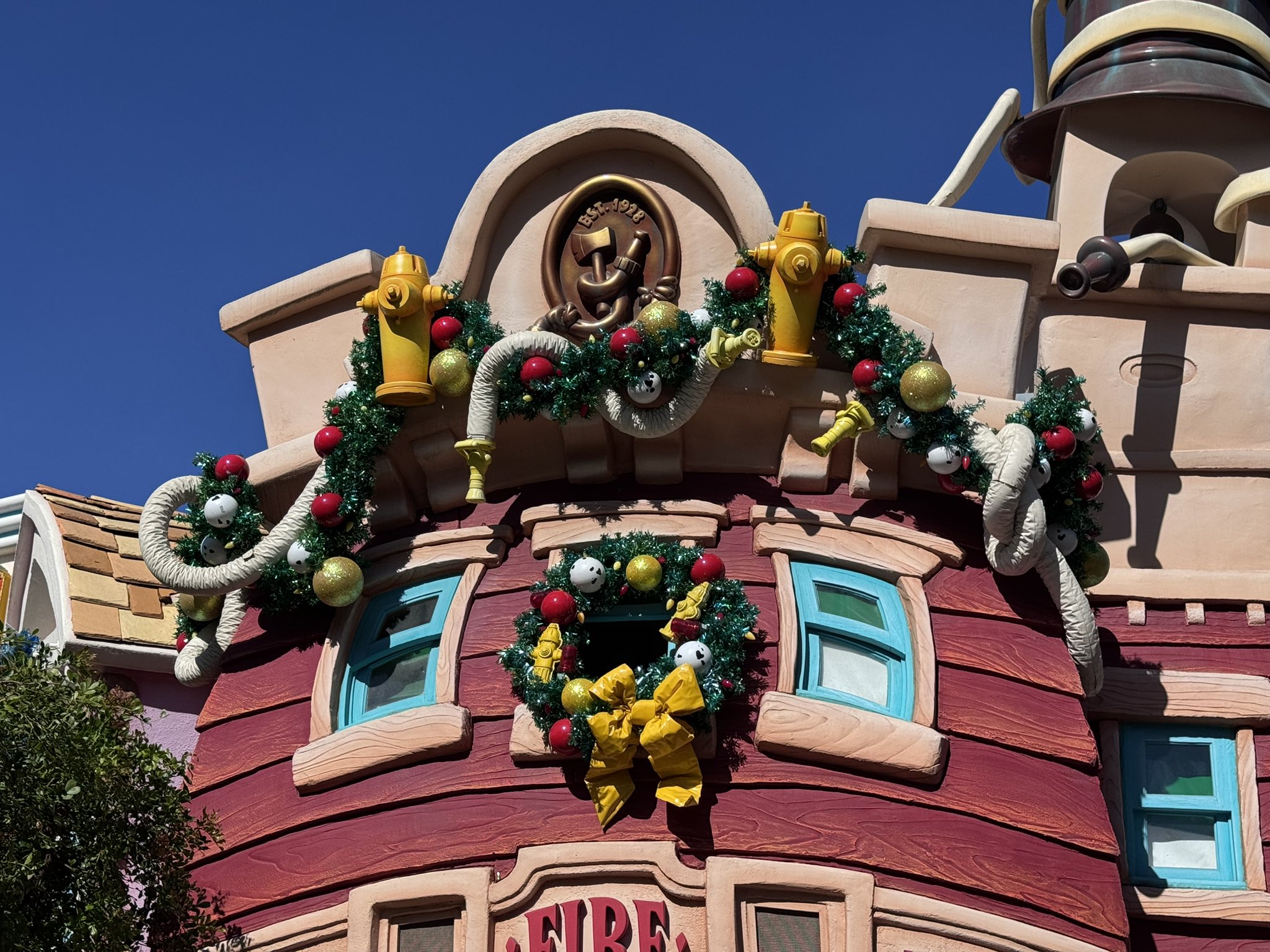 Christmas garland woven with fire hoses on the Toontown fire station at Disneyland