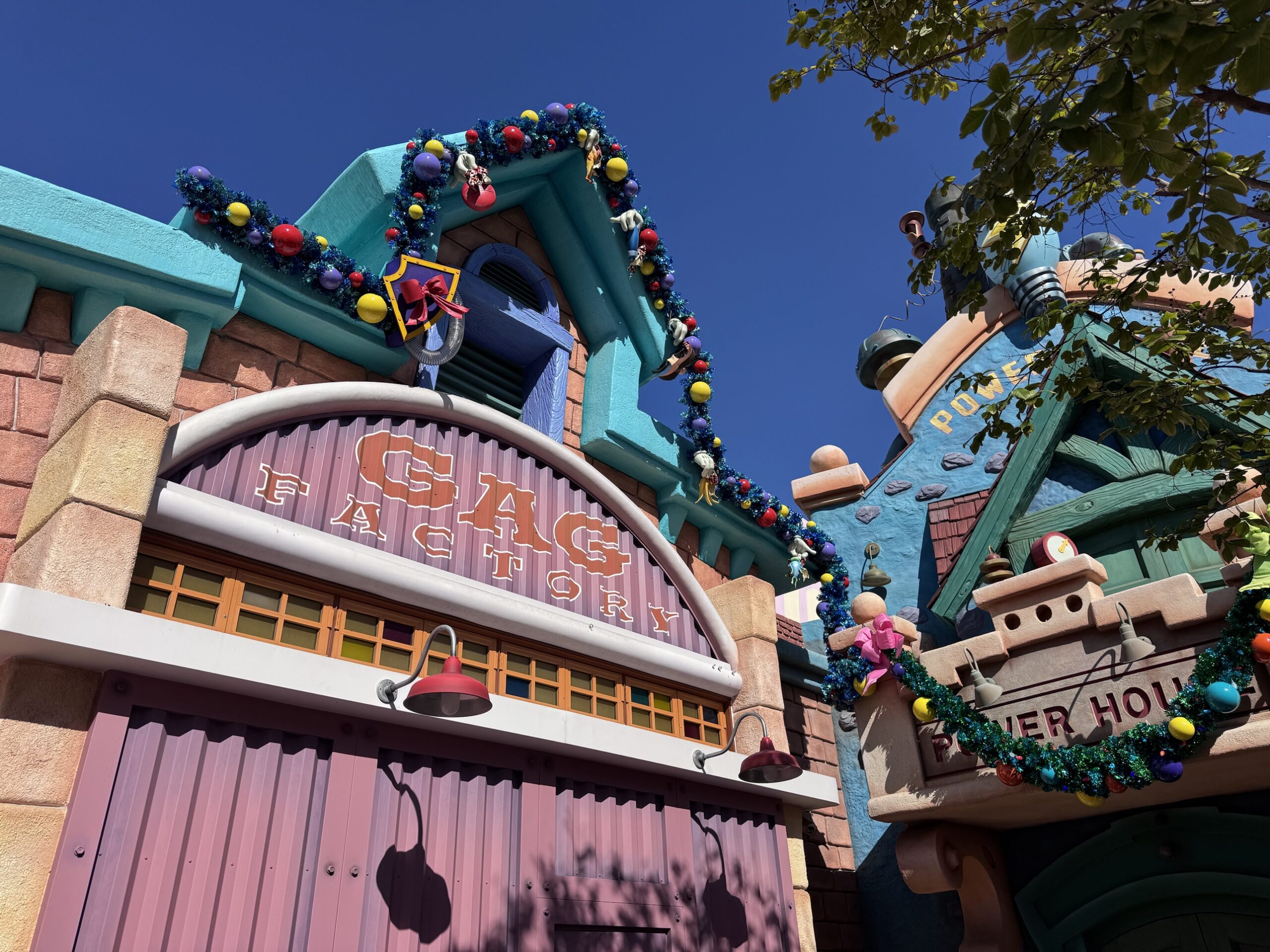 Christmas garland on the Gag Factory and Power House in Mickey's Toontown at Disneyland