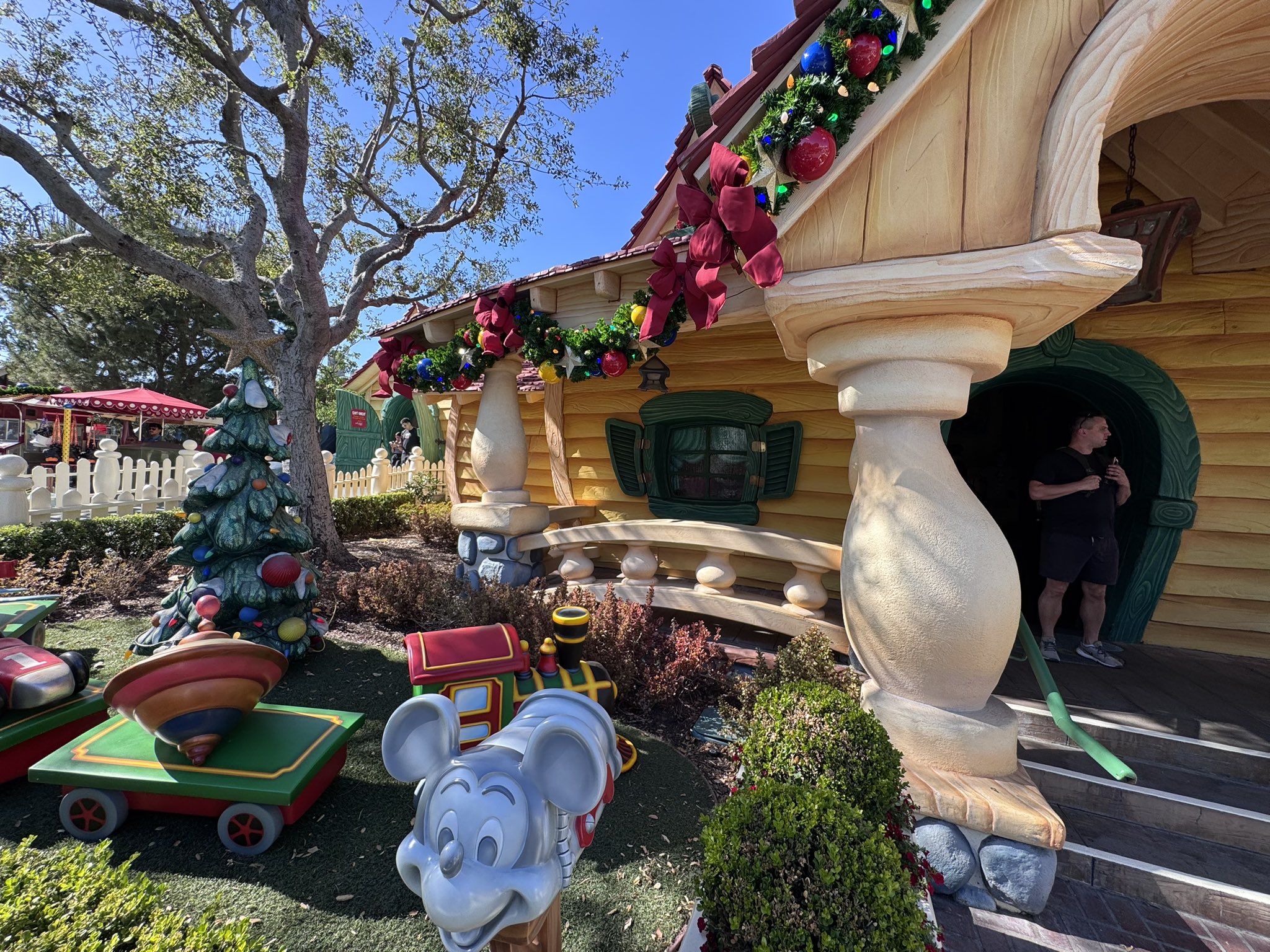 Garland, red bows and a toy Christmas tree at Mickey's House in Toontown at Disneyland