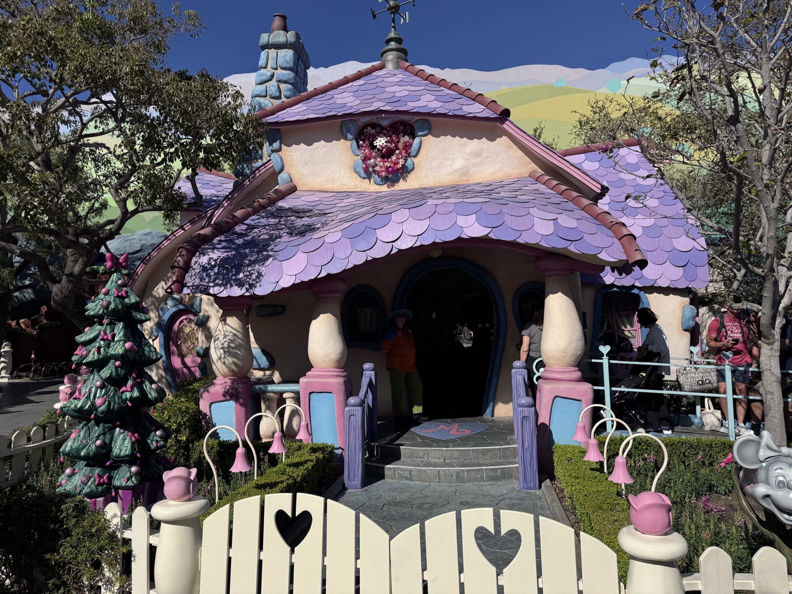 Christmas tree with pink bows and a heart wreath at Minnie's House in Toontown at Disneyland