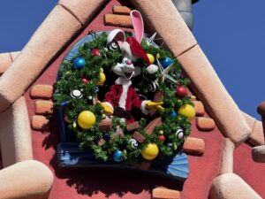 Roger Rabbit in a Santa suit inside a Christmas wreath in Mickey's Toontown at Disneyland
