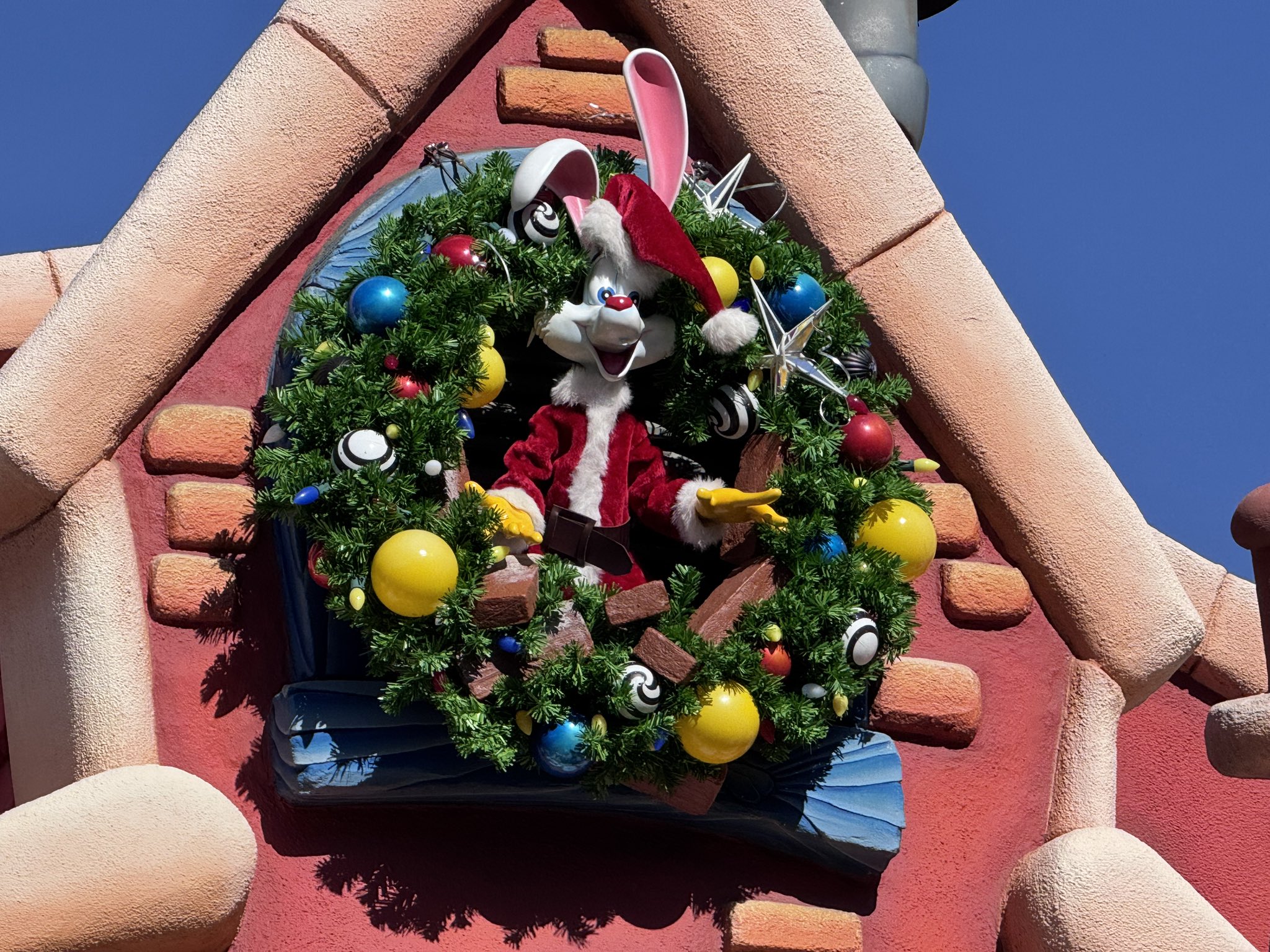 Roger Rabbit in a Santa suit inside a Christmas wreath in Mickey's Toontown at Disneyland